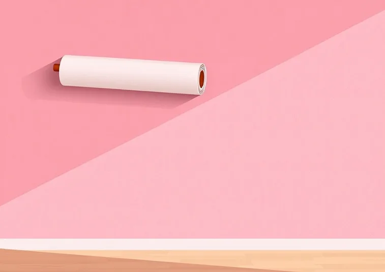 Pose de papier peint, rouleau et brosse à maroufler